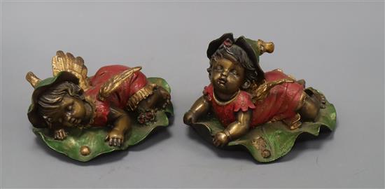 A pair of bronze cherubs on leaves Height 13cm